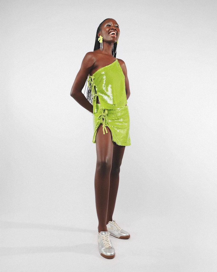 Mini saia curta paetê com laços - verde